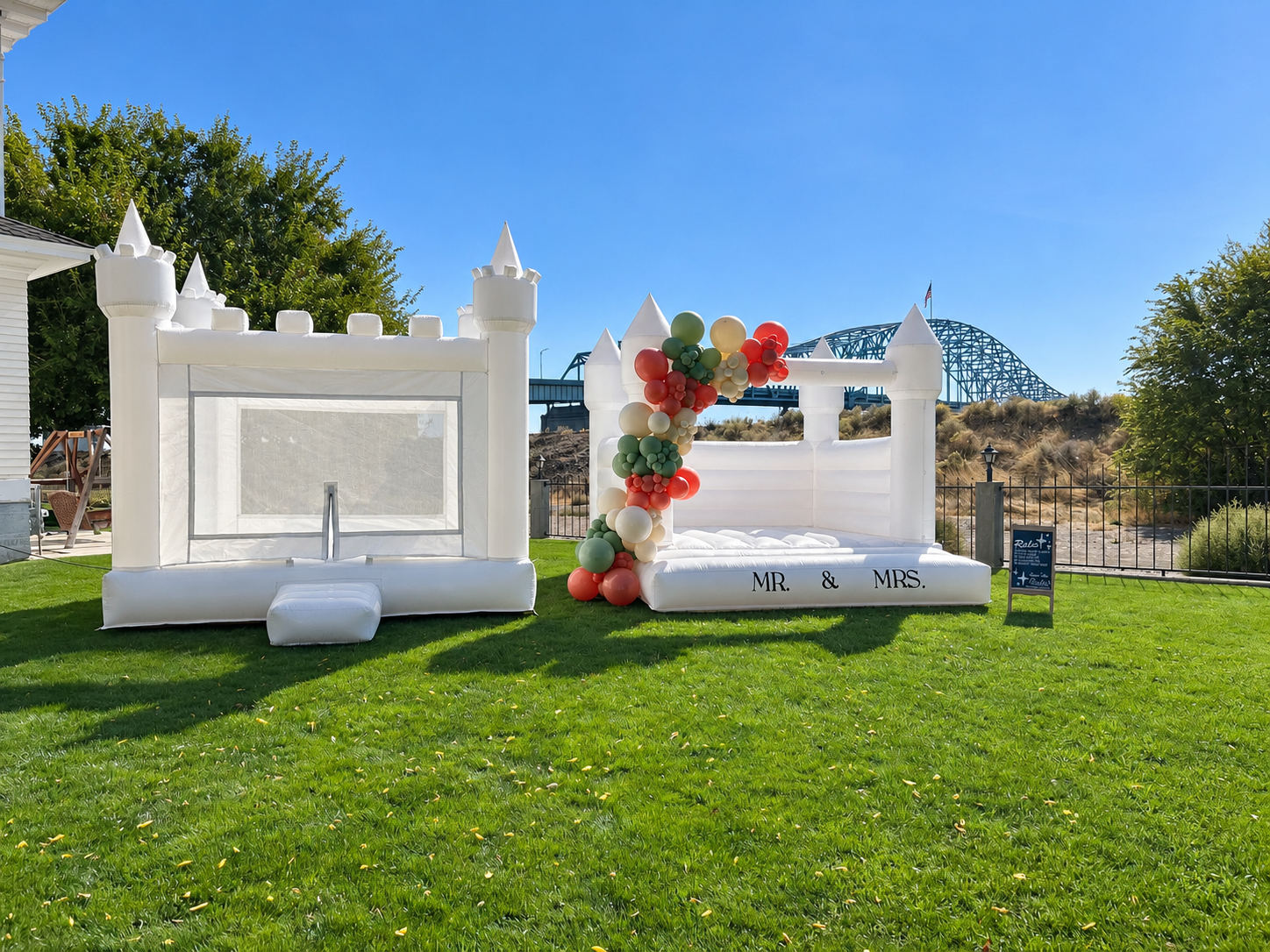White Castle Bounce Houses Under Blue Skies